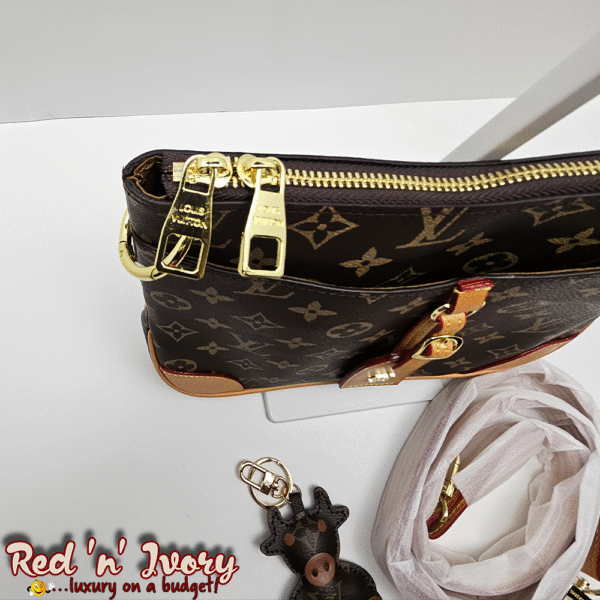 DAO1 Monogram Sling (DAO)